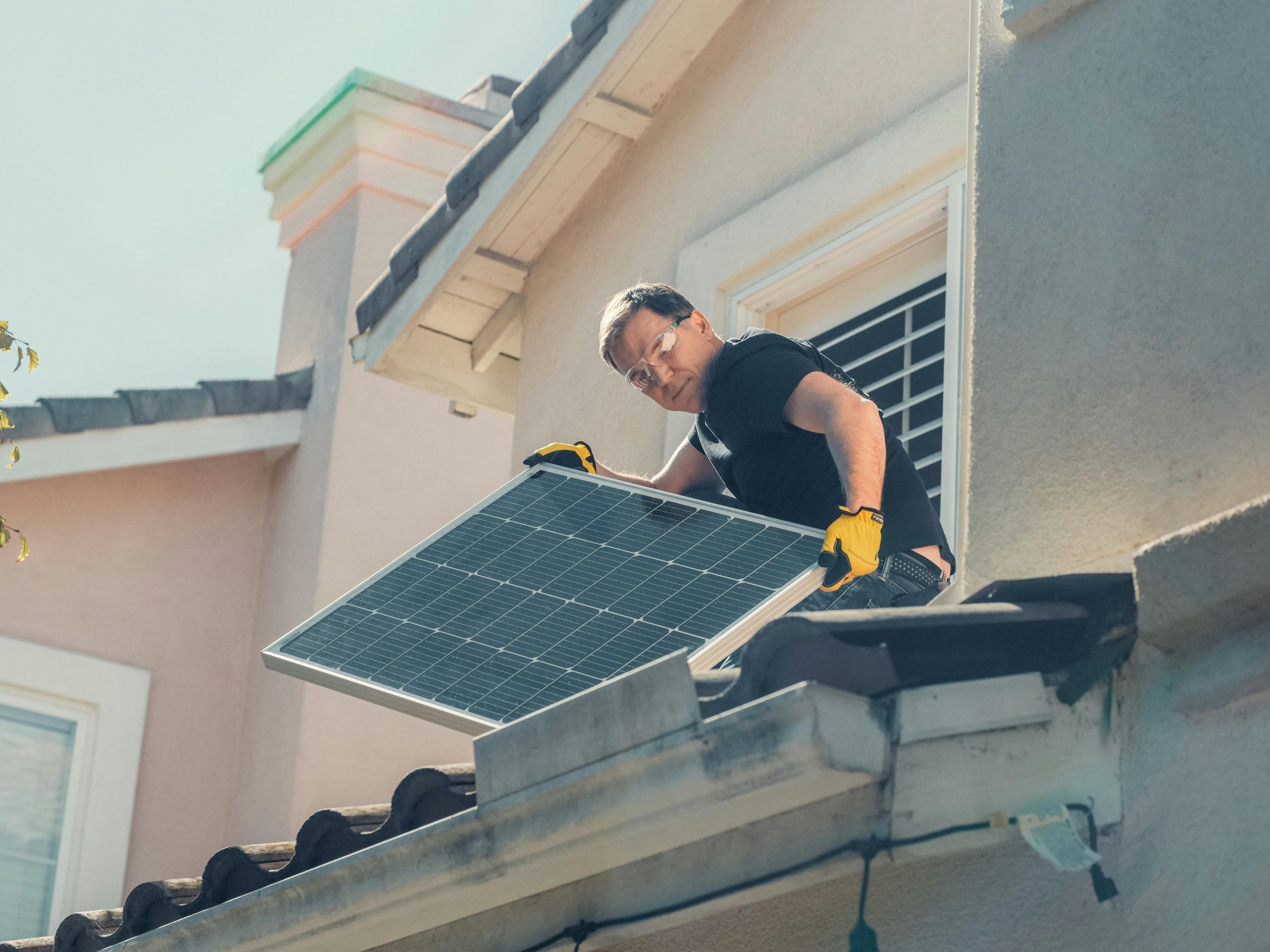 pexels-kindelmedia-9875411 Solar panel maintenance Farnborough Man fitting solar panels