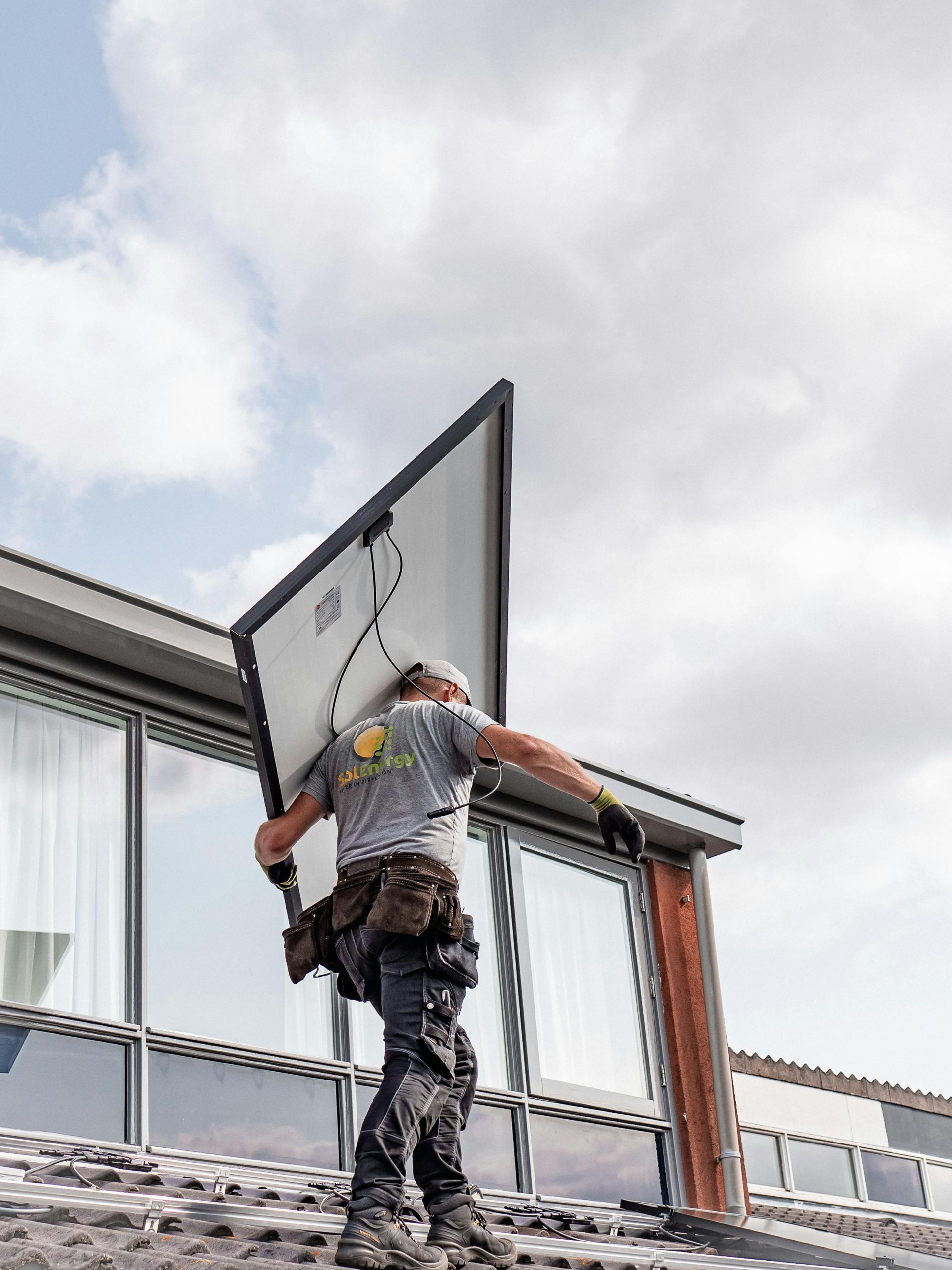 Man inspecting solar panels solar panel maintenance in Farnham Surrey Solar Solutions
