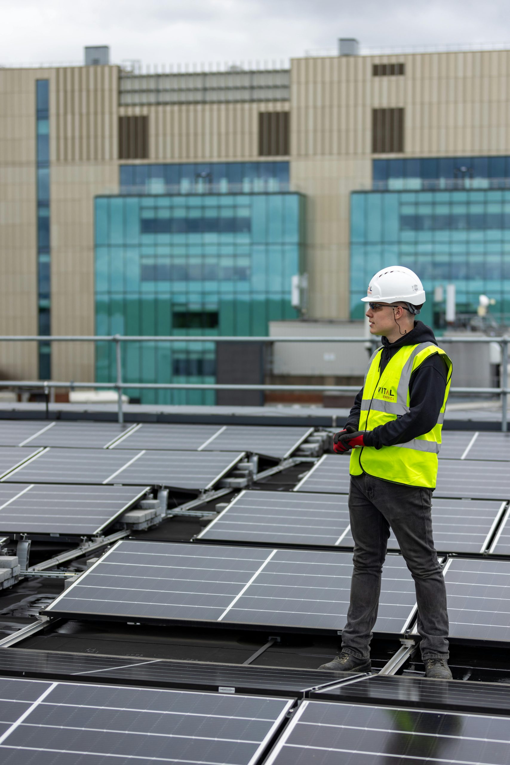 Man inspecting solar panels solar panel maintenance in Farnham Surrey Solar Solutions